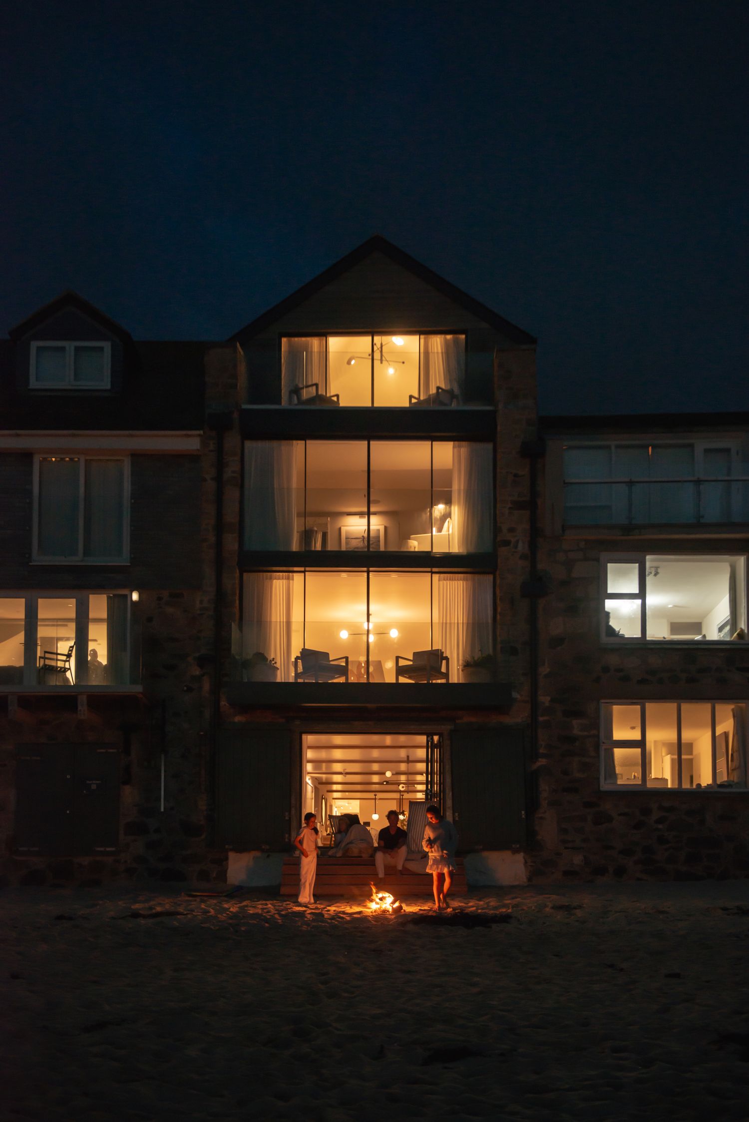 St Christopher's lit from within, seen from Porthmeor Beach at night