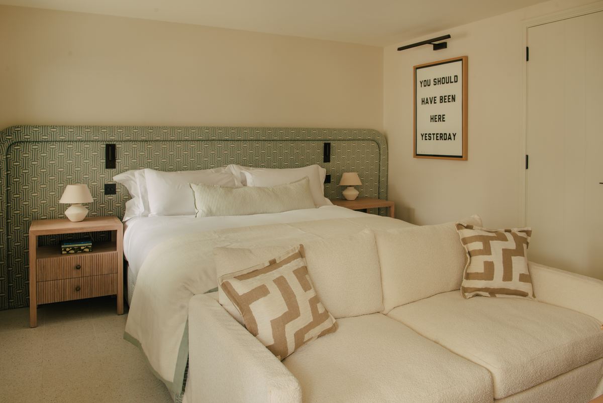 Bedroom with a green headboard