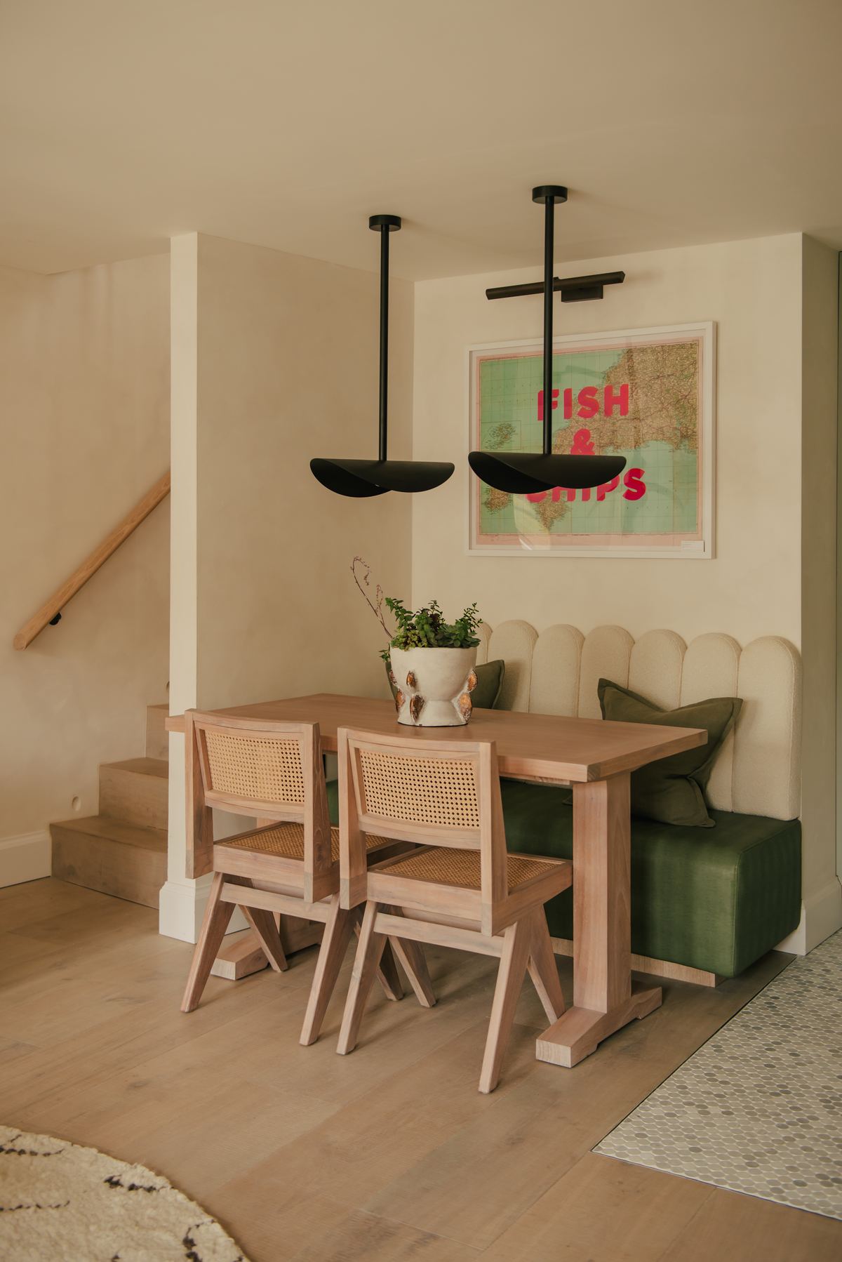 Dining table beneath a pendant