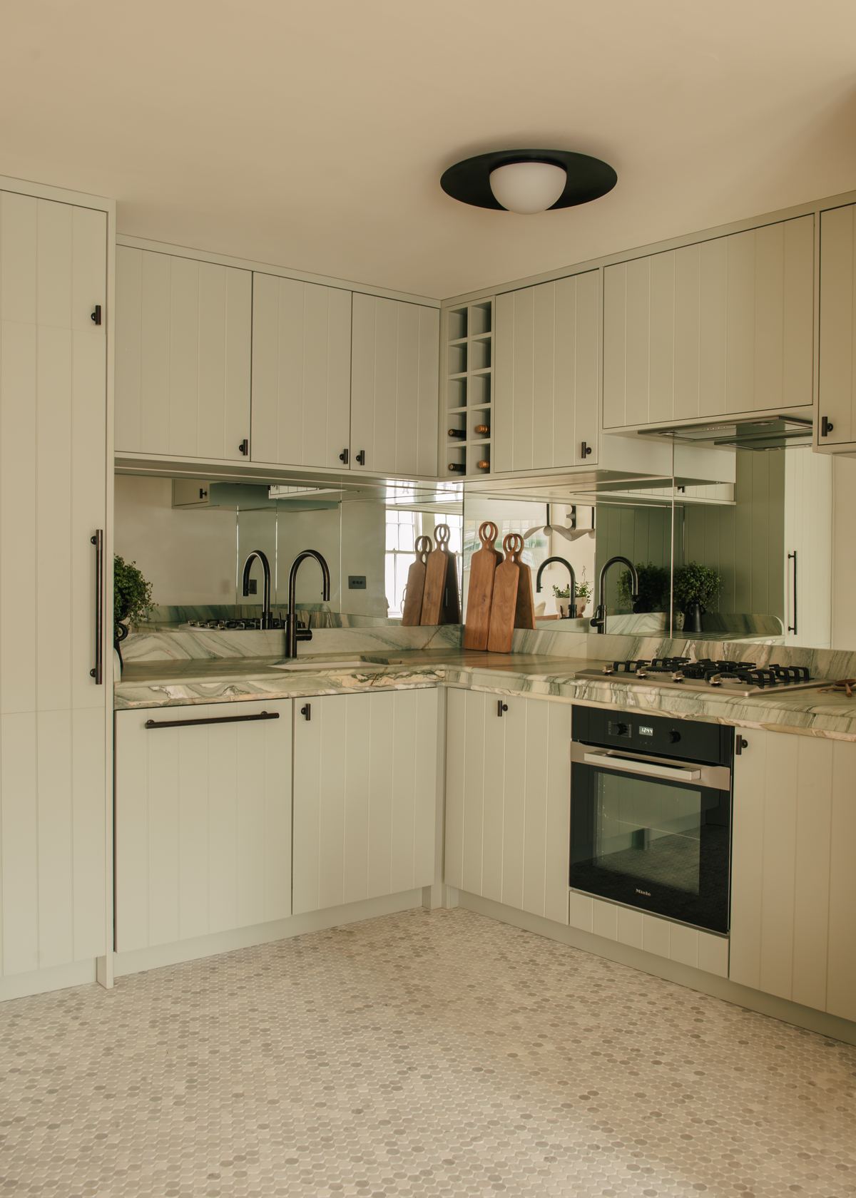 Pale green fitted kitchen