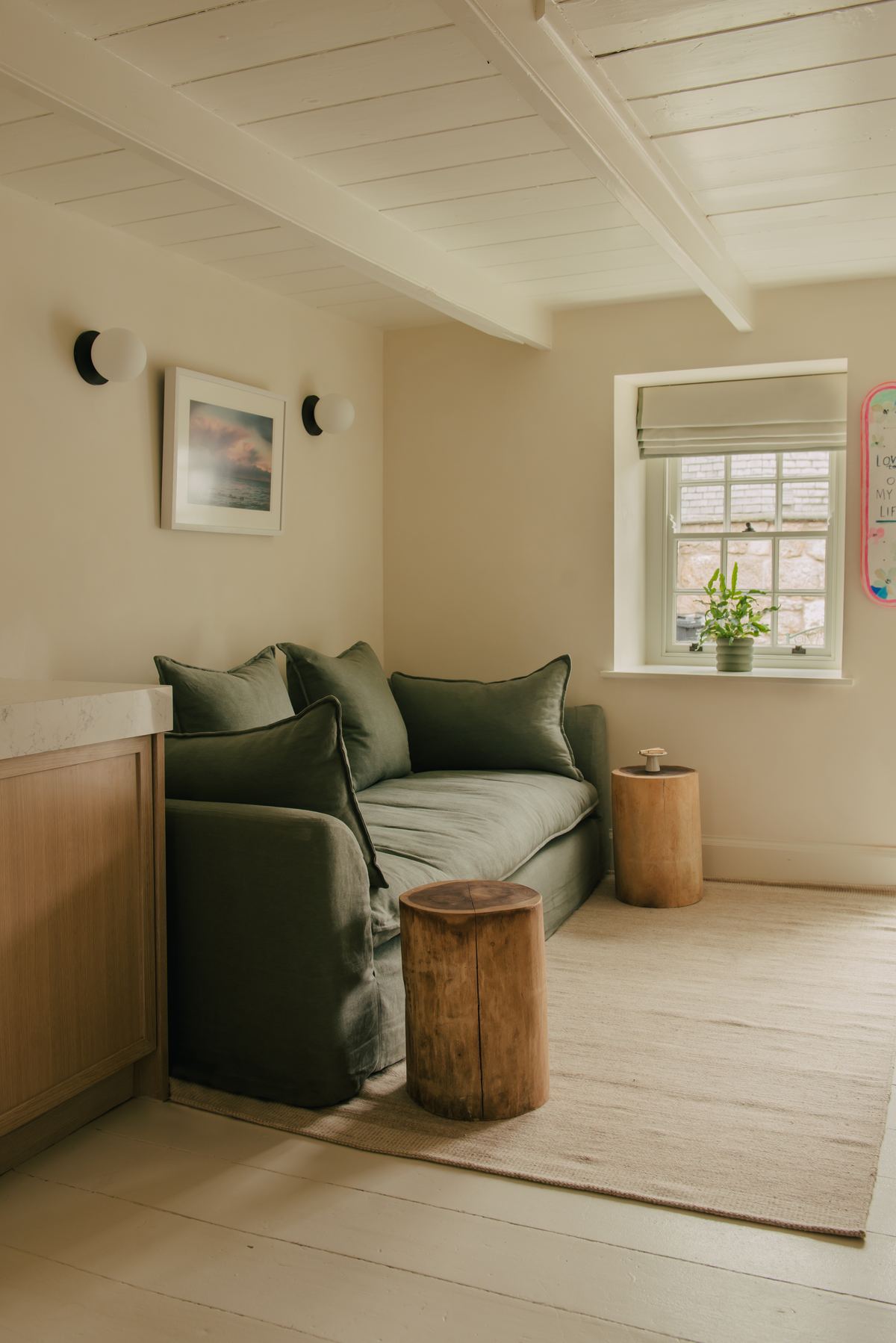 Sitting area with a green sofa