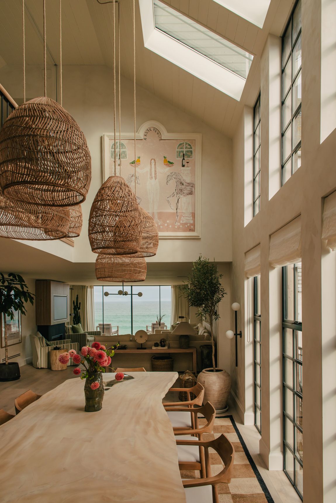 Double-height dining room with woven pendants